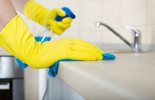 Local sofa cleaning service preparing a corner sofa for deep cleaning
