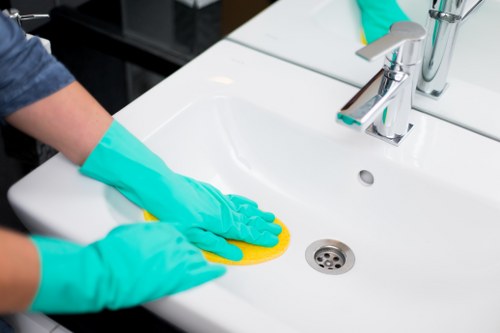 Local oven cleaner working in a Barnet kitchen with careful preparation