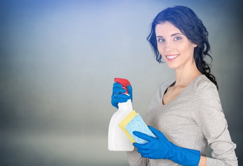 Local cleaner maintaining a lift lobby in a Barnet building